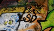 Graffiti with alcohol and drugs themes is seen inside the Corral Canyon Cave in Malibu, Calif., on Friday, May 6, 2016.  Fans of the band who have marked up a scenic cave on the California coast with psychedelic graffiti will have to find another place to spray out their love for frontman Jim Morrison. (AP Photo/Damian Dovarganes) **FILE**