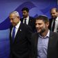 Israeli Prime Minister Benjamin Netanyahu, left, and Finance Minister Bezalel Smotrich, right, arrive to attend a Cabinet meeting at the Prime Minister&#x27;s office in Jerusalem, Feb. 23, 2023. The ultranationalist member of Israel&#x27;s ruling coalition says there&#x27;s no such thing as a Palestinian people. Finance Minister Smotrich&#x27;s remark Sunday, March 19, came within hours of efforts to calm tensions between Israel and the Palestinians over the country&#x27;s contentious plan to overhaul the judiciary. (Ronen Zvulun/Pool Photo via AP, File)