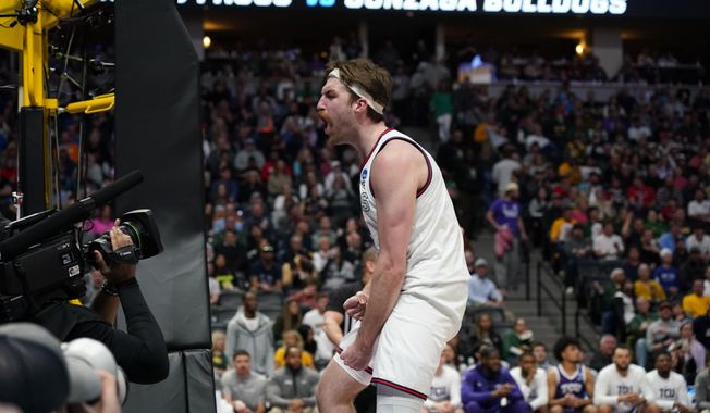 Gonzaga forward Drew Timme reacts after scoring a basket against TCU during the first half of a second-round college basketball game in the men&#x27;s NCAA Tournament on Sunday, March 19, 2023, in Denver. (AP Photo/John Leyba)