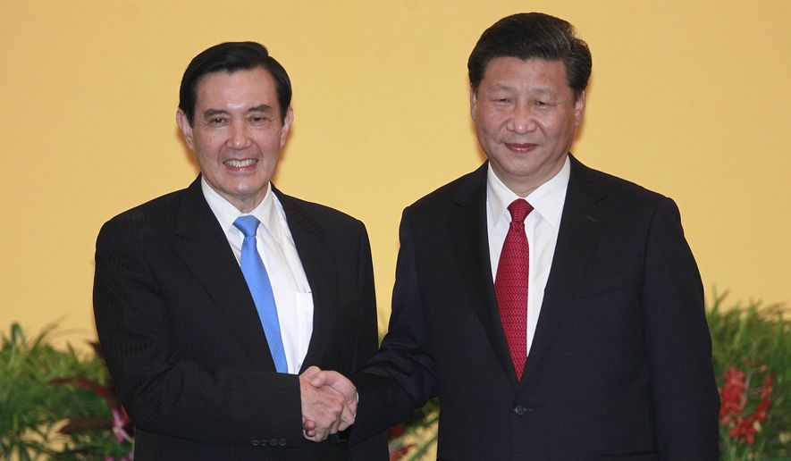Then Taiwan&#x27;s President Ma Ying-jeou, left, and China&#x27;s President Xi Jinping shake hands at the Shangri-la Hotel on Nov. 7, 2015, in Singapore. Former Taiwan President Ma will visit China next week, in what a spokesman called an independent bid to ease tensions between the self-ruled island and the mainland. Ma, who&#x27;s a member of the opposition Nationalist Party (Kuomingtang), will lead a delegation of academics and students as well as his former presidential staffers from March 27 to April 7, his office said Sunday. (AP Photo/Chiang Ying-ying)