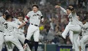 Japan players celebrate after beating Mexico 6-5 during a World Baseball Classic game, Monday, March 20, 2023, in Miami. (AP Photo/Wilfredo Lee)