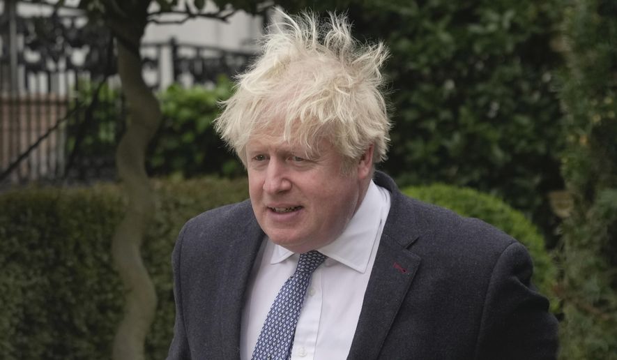 Former British Prime Minister Boris Johnson leaves his home, in London, Tuesday, March 21, 2023. (AP Photo/Kin Cheung)