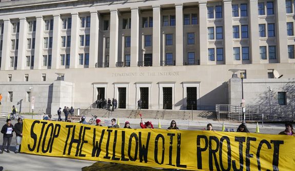 Demonstraters protest against the Biden administration&#x27;s approval of the Willow oil-drilling project before a scheduled speech by Biden at the Department of the Interior in Washington, Tuesday, March 21, 2023. (AP Photo/Patrick Semansky)