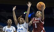 Oklahoma guard Nevaeh Tot (1) shoots over UCLA guard Londynn Jones (3) during the first half of a second-round college basketball game in the NCAA Tournament, Monday, March 20, 2023, in Los Angeles. (AP Photo/Kyusung Gong)