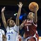 Oklahoma guard Nevaeh Tot (1) shoots over UCLA guard Londynn Jones (3) during the first half of a second-round college basketball game in the NCAA Tournament, Monday, March 20, 2023, in Los Angeles. (AP Photo/Kyusung Gong)