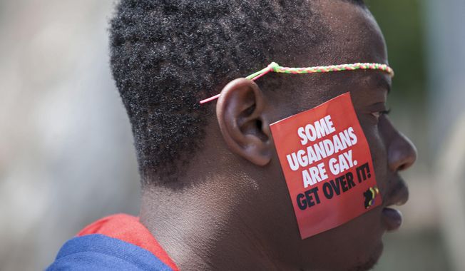FILE - A Ugandan man is seen during the third Annual Lesbian, Gay, Bisexual and Transgender (LGBT) Pride celebrations in Entebbe, Uganda on Aug. 9, 2014. Ugandan lawmakers passed a bill Tuesday, March 21, 2023 prescribing jail terms of up to 10 years for offenses related to same-sex relations, responding to popular sentiment but piling more pressure on the East African country&#x27;s LGBTQ community. (AP Photo/Rebecca Vassie, File)