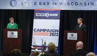 Wisconsin Supreme Court candidates Republican-backed Dan Kelly and Democratic-supported Janet Protasiewicz participate in a debate Tuesday, March 21, 2023, in Madison, Wis. (AP Photo/Morry Gash)