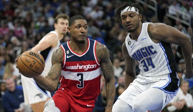 Washington Wizards&#x27; Bradley Beal (3) makes a move to get around Orlando Magic&#x27;s Wendell Carter Jr. (34) during the second half of an NBA basketball game, Tuesday, March 21, 2023, in Orlando, Fla. (AP Photo/John Raoux) **FILE**