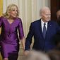 First lady Jill Biden, President Joe Biden, Vice President Kamala Harris and her husband Doug Emhoff arrive for an event in the East Room of the White House in Washington, Wednesday, March 22, 2023, to celebrate women&#x27;s history month. (AP Photo/Susan Walsh)
