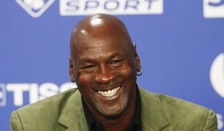 Basketball legend Michael Jordan speaks during a press conference ahead of an NBA basketball game between the Charlotte Hornets and Milwaukee Bucks in Paris, Jan. 24, 2020. Jordan is considering selling the Charlotte Hornets. The six-time NBA champion is in negotiations to sell at least a portion of the franchise to a group that includes Hornets minority owner Gabe Plotkin. (AP Photo/Thibault Camus, File)
