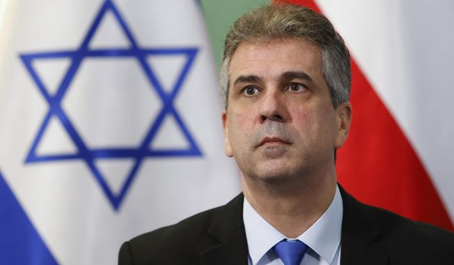 Israeli Foreign Minister Eli Cohen attends a joint press conference with his Polish counterpart Zbigniew Rau in Warsaw, Poland, Wednesday, March 22, 2023. (AP Photo/Michal Dyjuk)