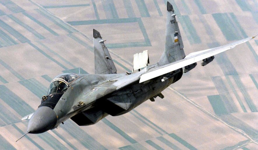 A Yugoslav air force Mig-29 fighter flies over Belgrade, on June 1998, during patrol duty. Slovakia was offered 12 new military helicopters by the United States as compensation for the MiG-29 fighter jets the country decided to give to Ukraine, Defense Minister Jaroslav Nad said on Wednesday, March 22, 2023. (AP photo/Sasa Radic) ** FILE **