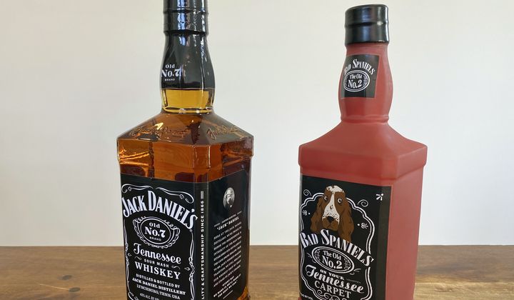 A bottle of Jack Daniel&#x27;s Tennessee Whiskey is displayed next to a Bad Spaniels dog toy in Arlington, Va., Nov. 20, 2022. The Supreme Court ruled unanimously Thursday that a dog toy mimicking the famous Jack Daniel’s whiskey bottle might have infringed — and damaged — the beverage company’s trademark. (AP Photo/Jessica Gresko) **FILE**