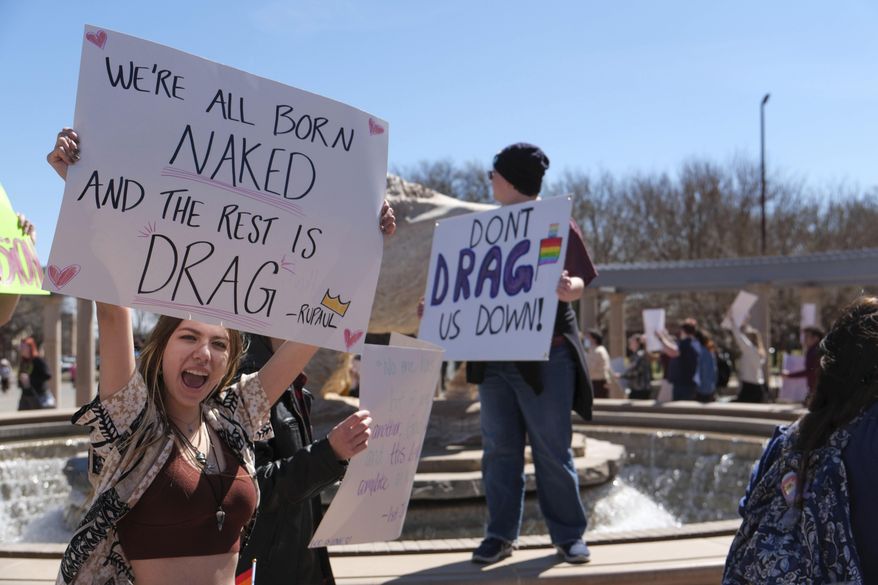 More than 50 people gathered Tuesday, March 21, 2023, at West Texas A&M University in Canyon, Texas, to protest the university president's decision to cancel a drag show on campus. (Michael Cuviello/Amarillo Globe-News via AP)