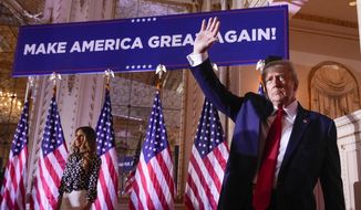 Former President Donald Trump waves after announcing he is running for president for the third time at Mar-a-Lago in Palm Beach, Fla., Nov. 15, 2022. (AP Photo/Andrew Harnik, File)