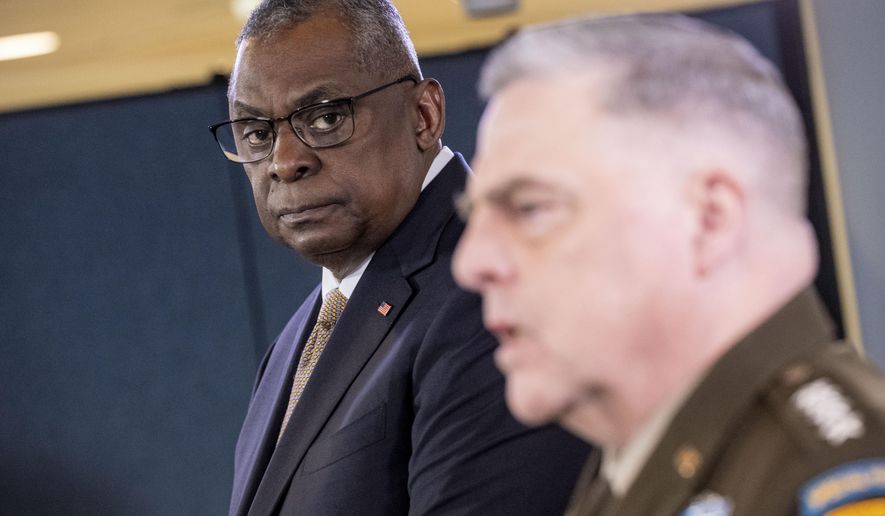 Chairman of the Joint Chiefs, Gen. Mark Milley, right, accompanied by Secretary of Defense Lloyd Austin, speaks during a briefing at the Pentagon in Washington, Wednesday, March 15, 2023. (AP Photo/Andrew Harnik) **FILE**