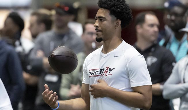 Former Alabama football quarterback Bryce Young works in position drills at Alabama&#x27;s NFL pro day, Thursday, March 23, 2023, in Tuscaloosa, Ala. (AP Photo/Vasha Hunt)