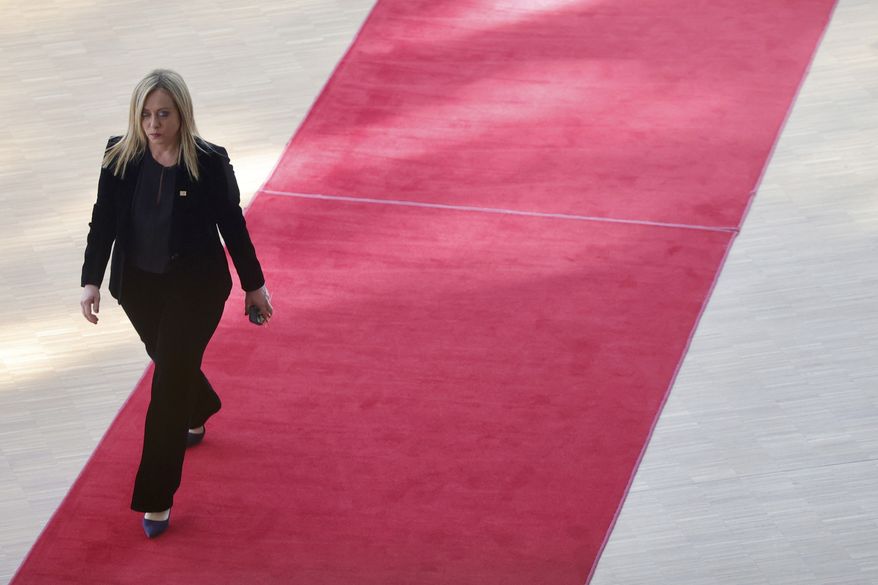 Italy's Prime Minister Giorgia Meloni arrives for an EU summit at the European Council building in Brussels, Thursday, March 23, 2023. European Union leaders meet Thursday for a two-day summit to discuss the latest developments in Ukraine, the economy, energy and other topics including migration. (AP Photo/Olivier Matthys)
