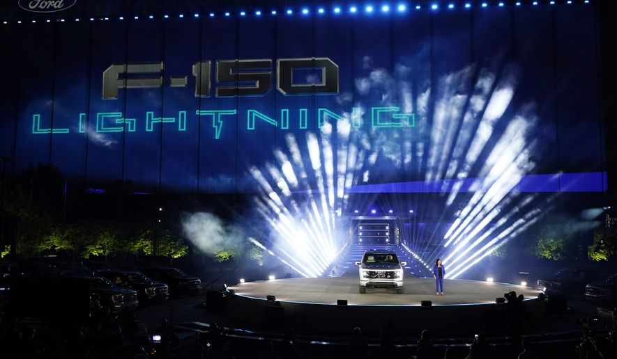 Ford&#x27;s Chief Executive Engineer Linda Zhang unveils the Ford F-150 Lightning on May 19, 2021, in Dearborn, Mich. Ford Motor Co. announced Thursday, March 23, 2023, that their electric vehicle business has lost $3 billion before taxes during the past two years and will lose a similar amount this year as the company invests heavily in the new technology. (AP Photo/Carlos Osorio, File)