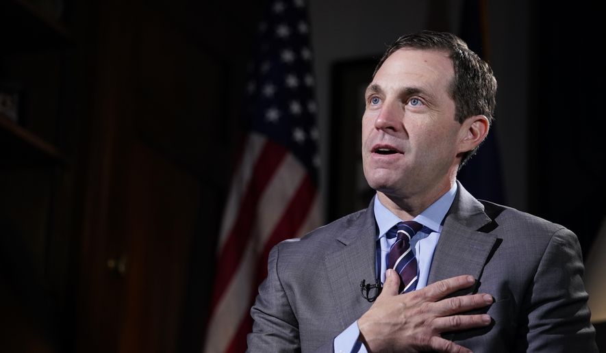 Rep. Jason Crow, D-Colo., talks during an interview with The Associated Press in his office on Capitol Hill in Washington, Dec. 15, 2021. (AP Photo/Susan Walsh, File)