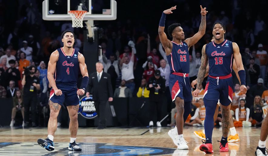 Florida Atlantic guards Bryan Greenlee (4), Brandon Weatherspoon (23) and Alijah Martin (15) react after the team defeated Tennessee 62-55 in a Sweet 16 college basketball game in the East Regional of the NCAA tournament at Madison Square Garden, Thursday, March 23, 2023, in New York. (AP Photo/Frank Franklin II)