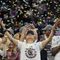 South Carolina head coach Dawn Staley celebrates after beating UConn, 64-49, to win the championship game of the NCAA college basketball Final Four in Minneapolis, Sunday, April 3, 2022. Women’s college basketball believes it has the makings for a hit reality TV show. Those engaged in the sport hope to give network execs another glimpse this weekend of why they need to ante up during March Madness. (AP Photo/Eric Gay) **FILE**