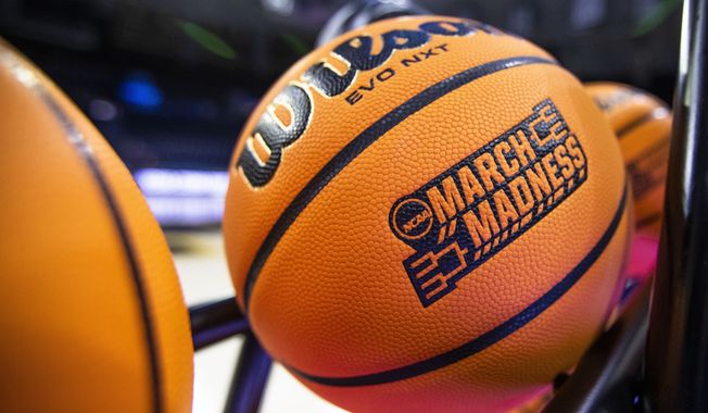 A basketball with a March Madness logo rests on a rack before a First Four game between Illinois and Mississippi State in the NCAA women&#x27;s basketball tournament Wednesday, March 15, 2023, in South Bend, Ind. An estimated 68 million Americans are expected to place bets on this year&#x27;s NCAA Men’s Basketball Tournament. And with a recent explosion in legalized online sports gambling across the United States, the opportunities to bet on this year’s bracket will reach far beyond your office pool. (AP Photo/Michael Caterina, File)