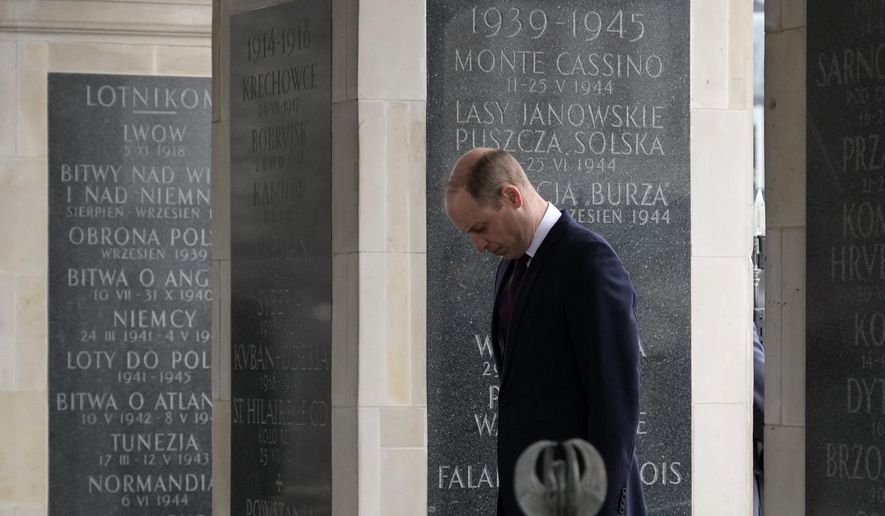 Britain&#x27;s Prince William arrives to lay a wreath of flowers at the Tomb of the Unknown Soldier in Warsaw, Poland, Thursday, March 23, 2023. (AP Photo/Czarek Sokolowski)