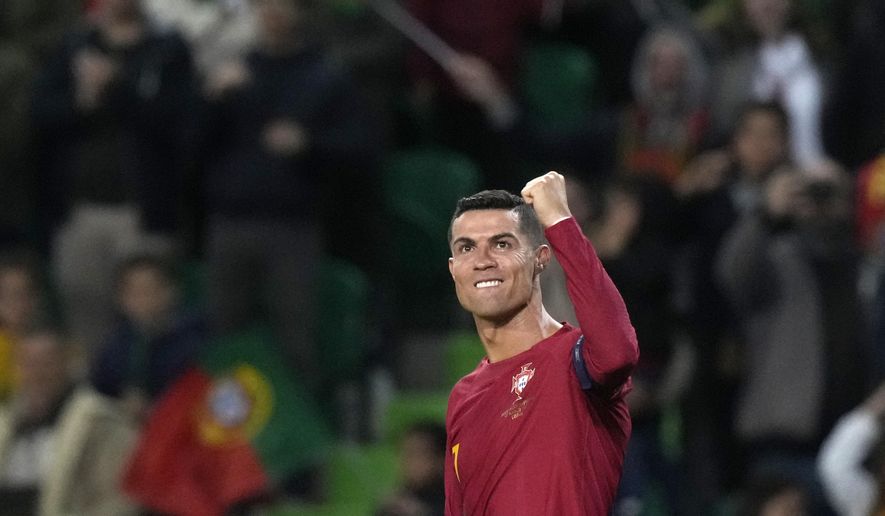 Portugal&#x27;s Cristiano Ronaldo celebrates after scoring his side&#x27;s fourth goal during the Euro 2024 group J qualifying soccer match between Portugal and Liechtenstein at the Jose Alvalade stadium in Lisbon, Portugal, Thursday, March 23, 2023. (AP Photo/Armando Franca)