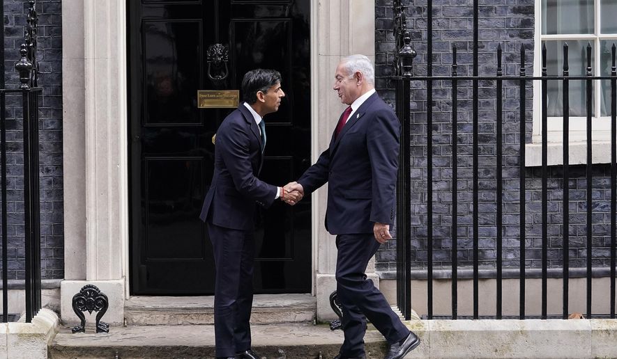 Britain&#x27;s Prime Minister Rishi Sunak, left, welcomes Israel Prime Minister Benjamin Netanyahu at Downing Street in London, Friday, March 24, 2023.(AP Photo/Alberto Pezzali)