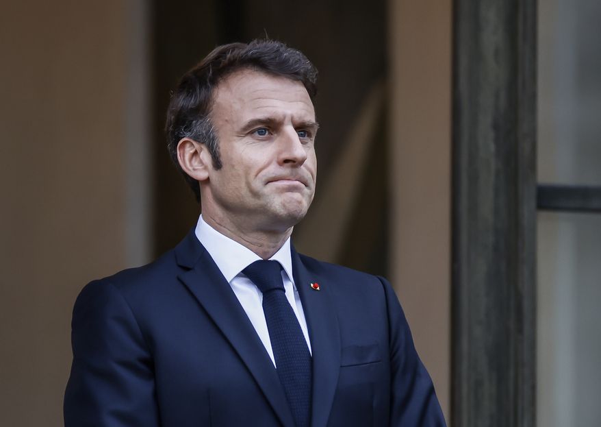 French President Emmanuel Macron awaits President of Costa Rica Rodrigo Chaves Robles for a meeting at the Elysee Palace in Paris, Friday, March 24, 2023. (AP Photo/Thomas Padilla)