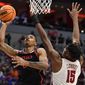 San Diego State forward Keshad Johnson (0) shoots against Alabama forward Noah Clowney (15) in the first half of a Sweet 16 round college basketball game in the South Regional of the NCAA Tournament, Friday, March 24, 2023, in Louisville, Ky. (AP Photo/Timothy D. Easley)