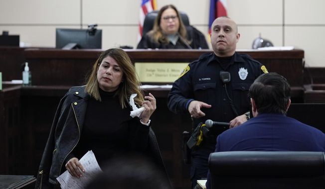 Irma Reyes, left, leaves Judge Velia Meza&#x27;s court after she was allowed to make a statement, Monday, Jan. 23, 2023, in San Antonio. Reyes&#x27; daughter was one of two teens who men were accused of keeping at a San Antonio motel where other men paid to have sex with them in 2017. Their cases have seen years of delay, a parade of prosecutors, an aborted trial and, ultimately, a stark retreat by the government with the offer of a plea deal. (AP Photo/Eric Gay)