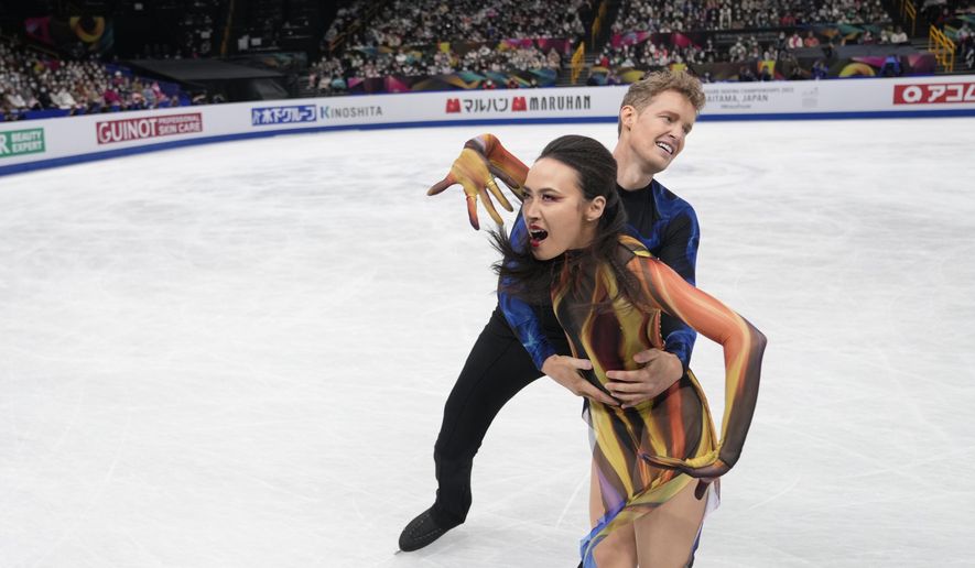Madison Chock and Evan Bates of the U.S. perform during the ice dance free dance program in the World Figure Skating Championships in Saitama, north of Tokyo, Saturday, March 25, 2023. (AP Photo/Hiro Komae)