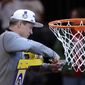 Florida Atlantic head coach Dusty May cuts the net after Florida Atlantic defeated Kansas State in an Elite 8 college basketball game in the NCAA Tournament&#x27;s East Region final, Saturday, March 25, 2023, in New York. (AP Photo/Adam Hunger)