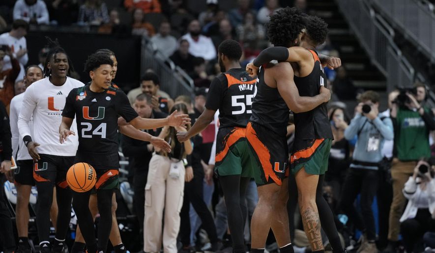 Miami celebrates after their win against Houston in a Sweet 16 college basketball game in the Midwest Regional of the NCAA Tournament Friday, March 24, 2023, in Kansas City, Mo. (AP Photo/Jeff Roberson)
