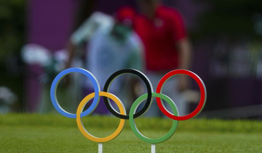 Carlos Ortiz of Mexico walks behind the Olympics rings symbol on the 11th fairway during the second round of the men&#x27;s golf event at the 2020 Summer Olympics on Friday, July 30, 2021, at the Kasumigaseki Country Club in Kawagoe, Japan. Mexico has declared its desire to host the Summer Olympics in 2036 or 2040 and says it already has most of the sports infrastructure required. (AP Photo/Matt York, File)