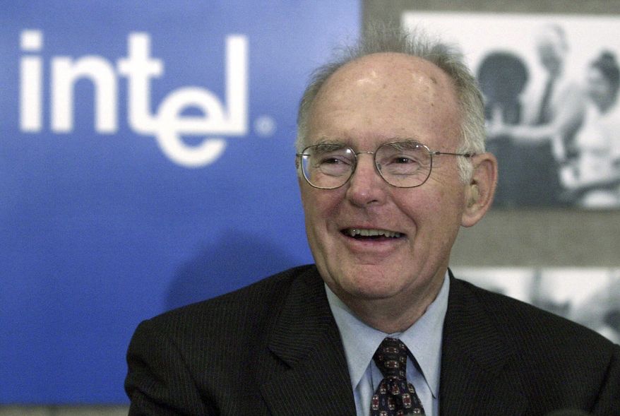 Gordon Moore, the legendary Intel Corp. co-founder who predicted the growth of the semiconductor industry, smiles during a news conference, Thursday, May 24, 2001, in Santa Clara, Calif. Moore, the Intel Corp. co-founder who set the breakneck pace of progress in the digital age with a simple 1965 prediction of how quickly engineers would boost the capacity of computer chips, has died. He was 94. Intel and the Gordon and Betty Moore Foundation say Moore died Friday, March 24, 2023 at his home in Hawaii. (AP Photo/Ben Margot, File)