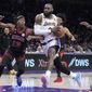 Los Angeles Lakers forward LeBron James drives to the basket past Chicago Bulls guard Ayo Dosunmu (12) during the second half of an NBA basketball game, Sunday, March 26, 2023, in Los Angeles. (AP Photo/Marcio Jose Sanchez)
