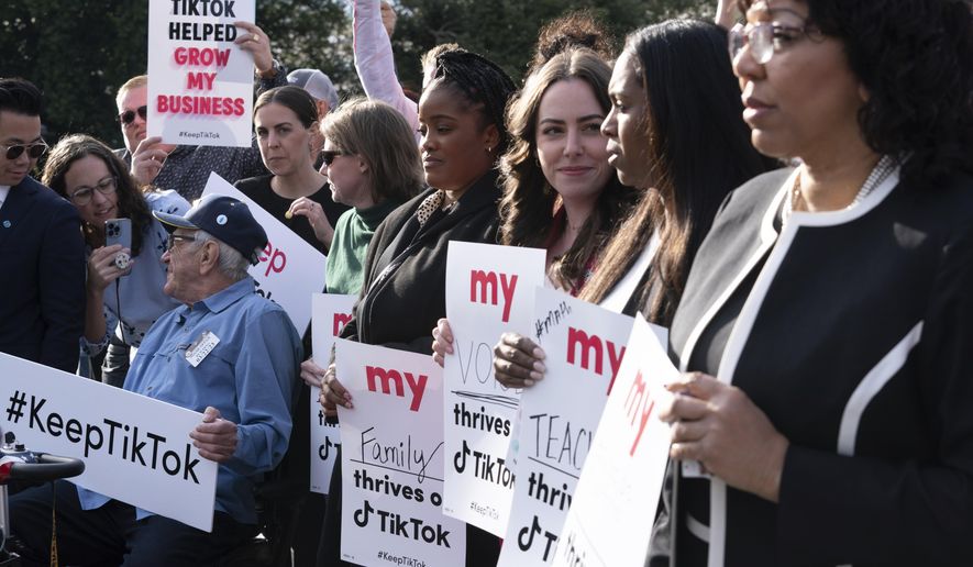 Supporters of TikTok hold signs during a rally to defend the app, Wednesday, March 22, 2023, at the Capitol in Washington. The House holds a hearing Thursday, with TikTok CEO Shou Zi Chew about the platform&#x27;s consumer privacy and data security practices and impact on kids. (AP Photo/Jose Luis Magana)