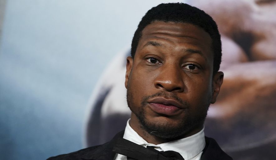 Jonathan Majors arrives at the premiere of &quot;Creed III&quot; on Feb. 27, 2023, at TCL Chinese Theatre in Los Angeles. The arrest of actor Majors on Saturday, March 25, 2023, has upended the Army’s newly launched advertising campaign that was aimed at reviving the service’s struggling recruiting numbers. (Photo by Jordan Strauss/Invision/AP, File)