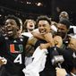 Miami celebrates after their win against Texas in an Elite 8 college basketball game in the Midwest Regional of the NCAA Tournament Sunday, March 26, 2023, in Kansas City, Mo (AP Photo/Jeff Roberson)