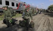 Russian recruits walk to take a train at a railway station in Prudboi, the Volgograd region of Russia, on Sept. 29, 2022. A campaign to replenish Russian troops in Ukraine with more soldiers appears to be underway again, with makeshift recruitment centers popping up in cities and towns, and state institutions posting ads promising cash bonuses and benefits to entice men to sign contracts enabling them to be sent into the battlefield. (AP Photo, File)