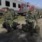 Russian recruits walk to take a train at a railway station in Prudboi, the Volgograd region of Russia, on Sept. 29, 2022. A campaign to replenish Russian troops in Ukraine with more soldiers appears to be underway again, with makeshift recruitment centers popping up in cities and towns, and state institutions posting ads promising cash bonuses and benefits to entice men to sign contracts enabling them to be sent into the battlefield. (AP Photo, File)