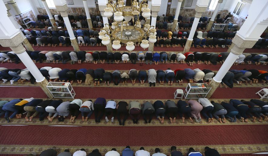 Algerians pray in Algiers, Monday March 27, 2023, on the fifth day of the Ramadan. Muslims over the world celebrate the holy fasting month of Ramadan. (AP Photo/Fateh Guidoum)