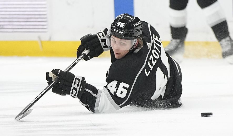 Los Angeles Kings center Blake Lizotte falls as he loses control of the puck during the first period of an NHL hockey game against the St. Louis Blues Saturday, March 4, 2023, in Los Angeles. (AP Photo/Mark J. Terrill)
