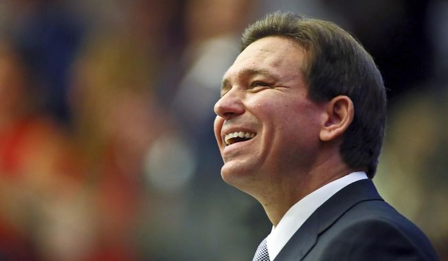 Florida Gov. Ron DeSantis smiles as he ends his State of the State address during a joint session of the Senate and House of Representatives Tuesday, March 7, 2023, at the Capitol in Tallahassee, Fla. (AP Photo/Phil Sears, File)