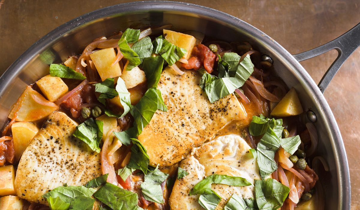 NextImg:Sicilian swordfish cooks gently in rustic tomato-caper sauce