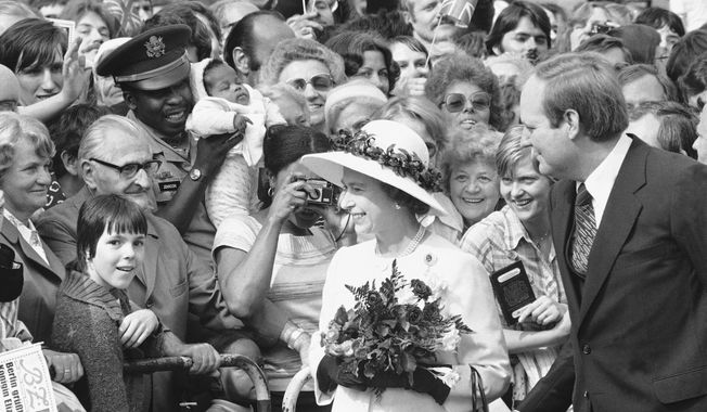 People gather to greet Britain&#x27;s Queen Elizabeth II as she walked along the famous Kurfuerstendamm Boulevard in West Berlin, Germany, on May 24, 1978. One would like two horses. That, in effect, was the gift requested by Britain&#x27;s Queen Elizabeth II during her state visit to Germany in 1978, weekly Der Spiegel reported Monday, March 27, 2023. (AP Photo) **FILE**