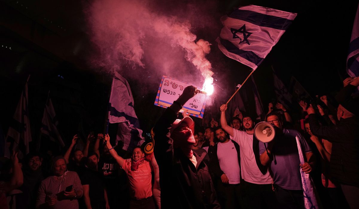 NextImg:Netanyahu moves to ‘avoid civil war,’ delays judicial overhaul plan amid strikes, protests